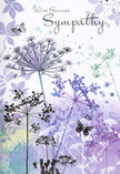 The design of this sympathy card reads like a quiet poem in watercolour, echoing the gentle calm you might feel sitting on a bench in Telegraph Hill Park, looking out over New Cross. Airy silhouettes of wildflowers stretch upward across the card, their stems thin and graceful, their umbelliferous flower heads rendered in soft shades of lavender, indigo, and pale blue. Each cluster of tiny blossoms looks almost weightless, with edges that dissolve gently into the background, creating the impression of a meadow at dusk, when colours soften and lines blur. The backdrop itself is composed of tender washes of muted purple and silvery green, drifting together like evening light over SE14 rooftops after a passing shower. Scattered among the blooms, butterflies appear in delicate outlines, their wings painted in barely-there tones that suggest both fragility and resilience. They hover close to the flowers, evoking transformation, enduring love, and the quiet presence of those who are gone but still deeply felt. Above or alongside this scene, the words With Sincere Sympathy are written in an elegant, flowing script that harmonises with the gentle curves of the stems. The overall mood is cool, calming, and deeply consoling, much like the thoughtful sympathy arrangements Flower Delivery New Cross prepares for families in the area. Nothing in the artwork overwhelms; instead, it wraps the recipient in a respectful, understated embrace, using the language of nature-soft colour, light texture, and open space-to carry a message of compassion and support.